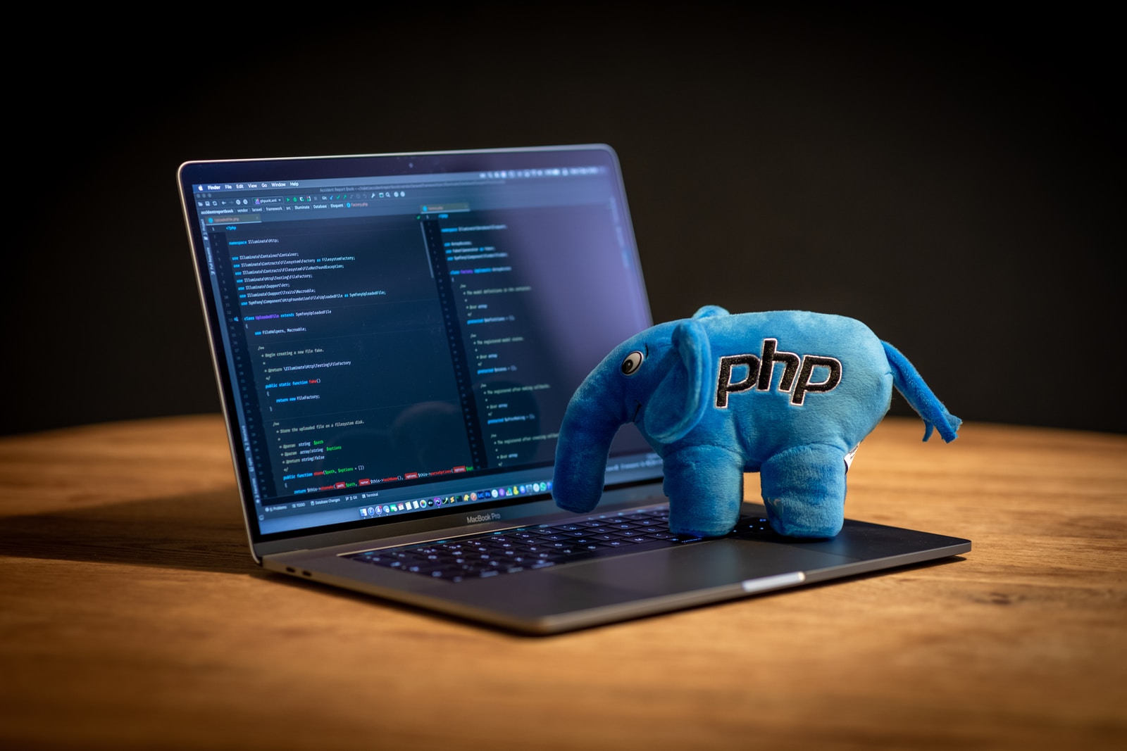 blue elephant plush toy on black laptop computer